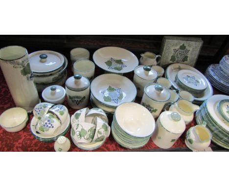 A collection of Poole pottery 'Vineyard' pattern dinner wares plus additional associated kitchenalia in the same pattern comp