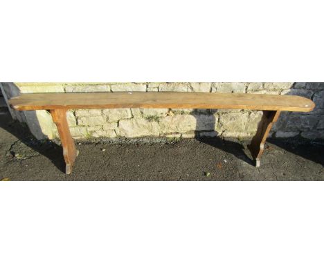 A simple antique country made bench or form in oak, on shaped supports, 50cm high x 190cm x 17cm wide