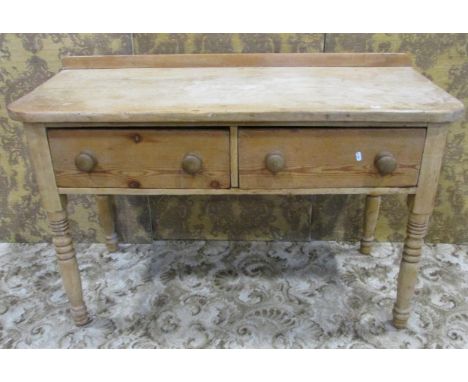 A 19th century stripped pine kitchen side table/dresser fitted with two deep frieze drawers, raised on ring turned and tapere