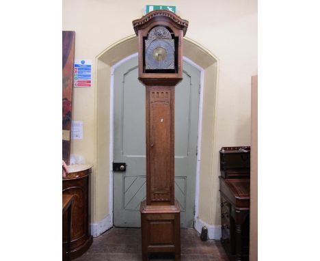 A 19th century oak longcase clock enclosing a brass and pewter dial and thirty hour striking movement 