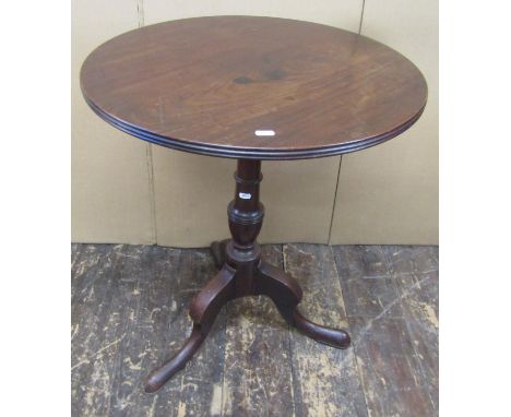 A Georgian mahogany tripod table, the one piece top 60cm diameter, raised on a vase shaped pillar and tripod, 71cm high