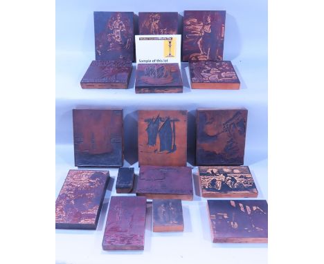 A collection of illustrative printers wood blocks, many featuring angels, varying in different dimensions, a metal lantern an