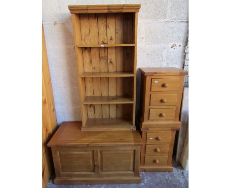 Pine blanket box, two - three drawer bedside chest and a small pine bookcase (4)