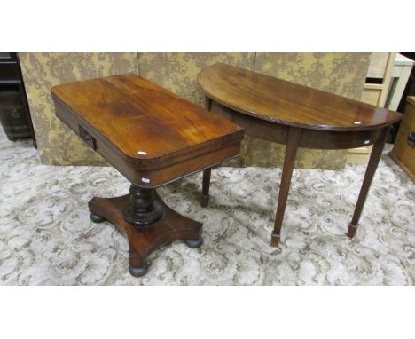 A 19th century rosewood  fold over top card table with carved and moulded detail raised on a turned pillar, shaped platform a