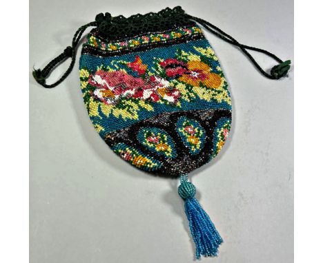 A 19th century hand worked Berlin beaded purse with repeating floral detail 