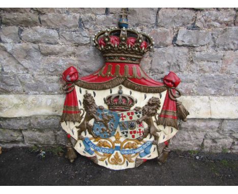 A heavy gauge cast metal heraldic shield shaped plaque with hand painted finish approx 95 cm high x 85 cm wide (af). We belev