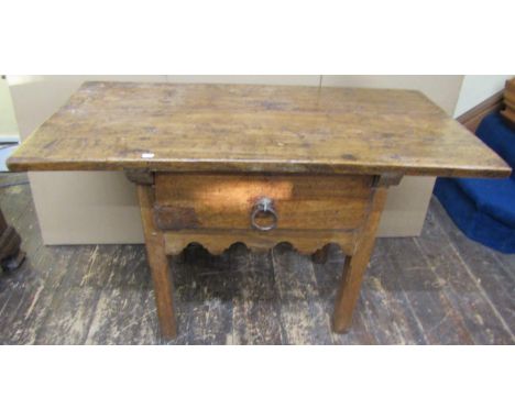 An 18th century walnut galleon table the plank top over a single deep drawer on square cut supports, 71cm high x 116cm wide x