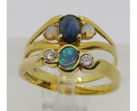 Two 18ct three stone rings; an opal and diamond example, maker 'RM', Sheffield 2000, size M/N, 2.8g and an Italian sapphire a