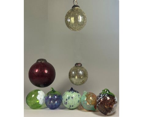 Eight blown glass Christmas tree baubles, of varying designs, and three cut glass scent bottles.