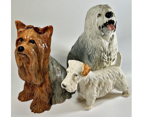 Three large ceramic dogs by Beswick to include an Old English Sheepdog, a white Scotty dog and a Yorkshire Terrier, the large