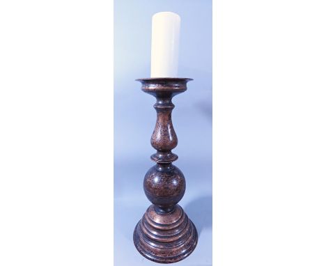 A SUBSTANTIAL BURNISHED BRONZE BALLUSTER SHAPED CANDLESTICK 50CM HIGH 