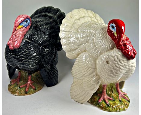 Two Royal Doulton ceramic Turkeys one black D7149 the other white D6889, 15cm tall approx (2) with certificates