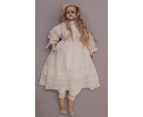 19th century Montanari type poured wax doll with inserted mohair, cloth body and wax lower limbs. Wearing a period lace trimm