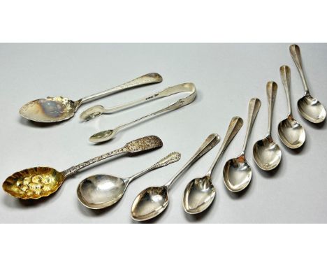 Four cased sets of six teaspoons, a single Christening silver spoon, a caddy spoon, and a small berry spoon and a sugar tong,