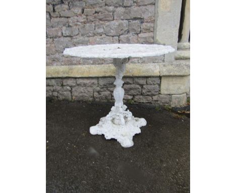 An unusual Victorian cast iron garden table with layers of painted finish the decorative pierced top with signs of the zodiac