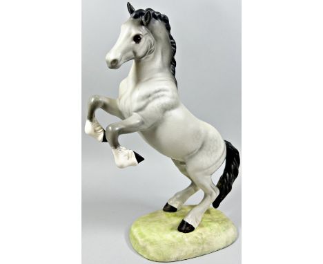 A Beswick model of a matt glazed grey horse in rearing pose with impressed number to base 1014, 26cm high approx