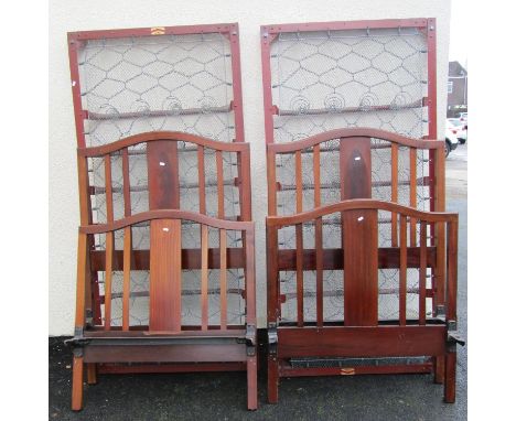 A pair of Edwardian mahogany single bed frames to accept a 3ft mattress 