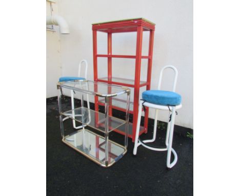 A red five-tier bookcase, 141cm high x 70cm x 35cm, together with a three tier glass and brass mounted drinks table, 73cm hig