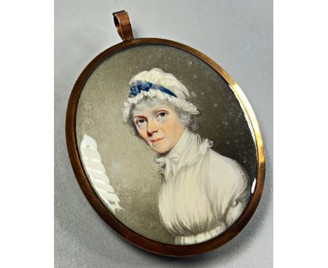 19th century British school, a good quality mourning portrait miniature, bust height portrait of a lady in lace bonnet tied w