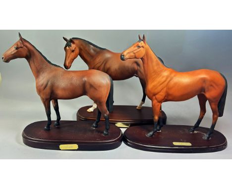 Three ceramic figures of horses by Royal Doulton comprising 'Red Rum' 'Arkle' and 'Troy' each approx 30cm x 30cm set on woode