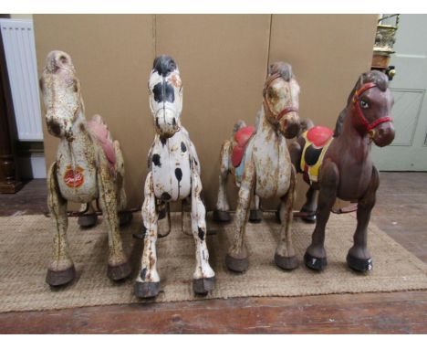 A collection of four Mobo Broncos (manufactured by D. Sebel &amp; Co) articulated horses, in original condition, each 75cm x 