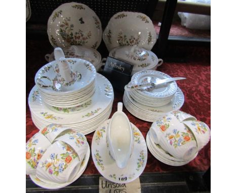 An Ansley Cottage Garden dinner service comprising dinner plates, further graduated plates, serving dishes, tureens and cover