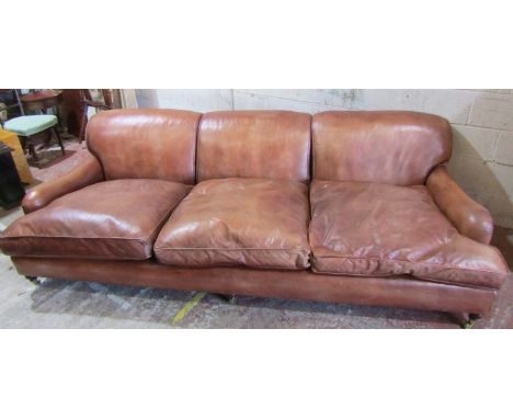 A good quality contemporary country house size tan leather upholstered sofa in the Howard style with loose seat cushions, app