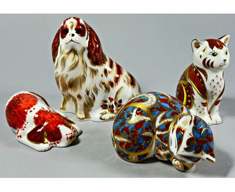 A collection of Royal Crown Derby Imari figures to include two dogs with gold stoppers and two cats one gold and one silver s