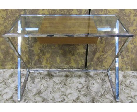 A Modernist desk/side table with rectangular inset glass top over a central wooden frieze drawer raised on open x framed chro