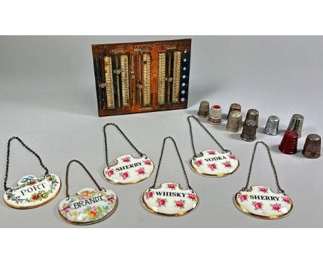 A knitting gauge - 'Handy Guide for Knitting and Crochet', together with silver thimbles and six ceramic decanter labels