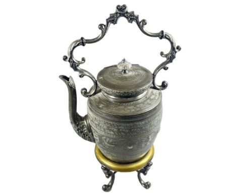 An Indian metal “zodiac” kettle with stand and burner. 