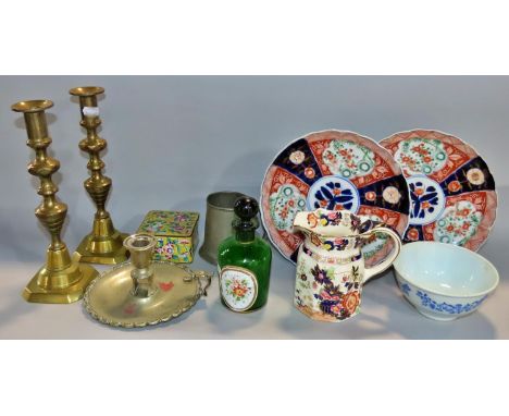 A miscellaneous collection of items including two Imari type plates, a pair of brass candlesticks, a cloisonné box, loose fla