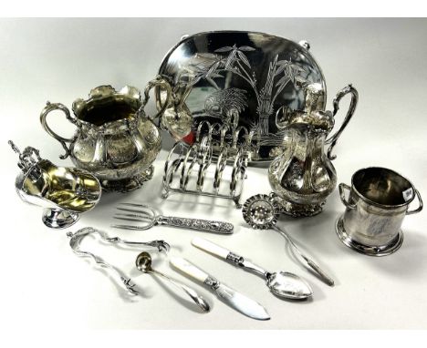 A selection of silver plated items, including a dish, toast rack, sugar bowl, cream jug, cased flatware, loose cutlery, and e