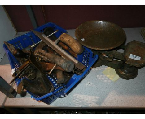 Set of metal scales and a basket of tools