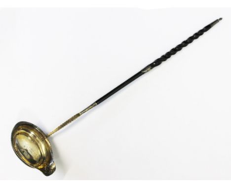 A George III hallmarked silver toddy ladle with twist baleen handle, length 41cm.