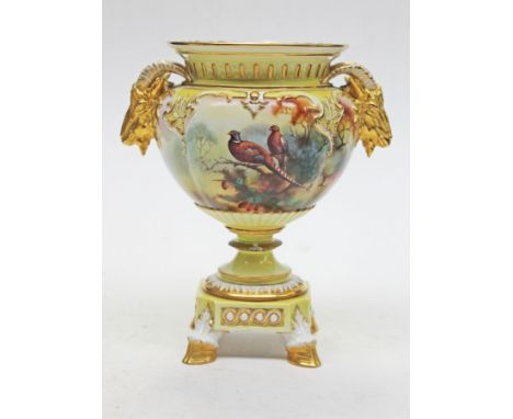 A Royal Worcester porcelain pedestal vase with ibex mask handles, hand painted pheasants signed A.C. Lewis, platform base wit