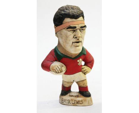 A Groggs ceramic figure of Emyr Lewis by John Hughes, signed with additional pen signature on base. Height 25cm. Condition - 