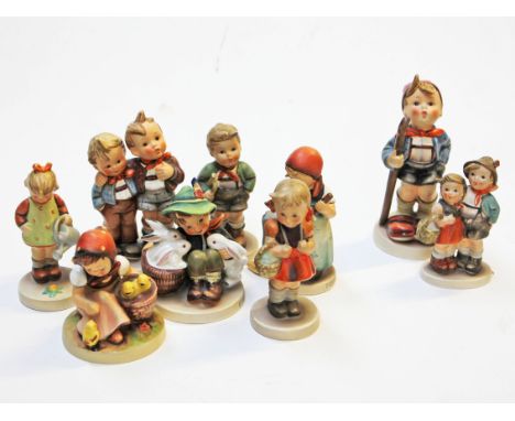 A group of nine Hummel figures. Condition - two damaged (picture right), otherwise good.