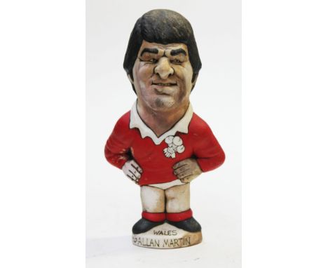 A Groggs ceramic figure of Allan Martin, height 25cm. Condition - wear to red paintwork on shirt, other general wear.