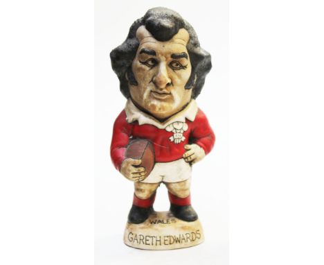 A Groggs ceramic figure of Gareth Edwards by John Hughes, signed, height 24cm. Condition - good, general wear.