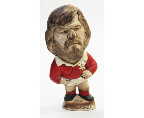 A Groggs ceramic figure of Derek Quinnell, height 26cm. Condition - good, general wear.