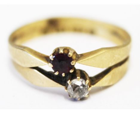 An 18ct gold diamond and garnet ring, gross wt. 2.6g, size M.