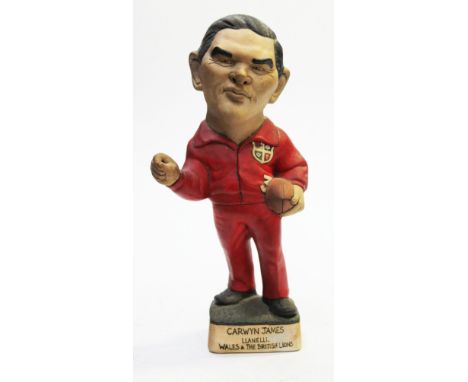 A Groggs ceramic figure of Carwyn James by Richard Hughes, signed. Height 32cm. Condition - good, general wear.