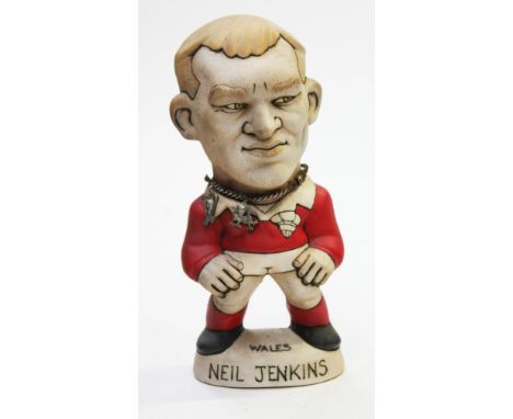 A Groggs ceramic figure of Neil Jenkins, height 23cm. Condition - good, general wear.