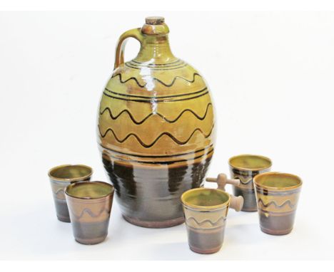 A Sidney Tustin Winchcombe pottery flagon and five beakers, height 35cm. Condition - two beakers cracked, general wear to inc