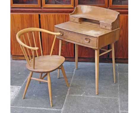 An Ercol light elm and beech desk and chair. Desk W69cm D46cm H96cm.