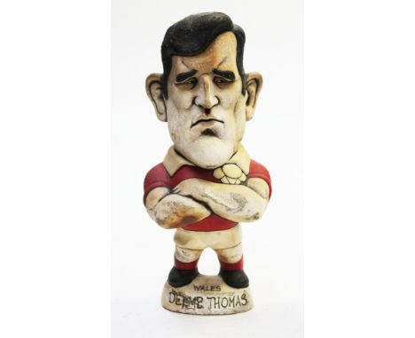 A Groggs ceramic figure of Delme Thomas, height 26 cm. Condition - remnants of damp material present, needs cleaning, other g