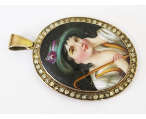 A 19th Century yellow metal mounted miniature portrait on porcelain, length 5cm.