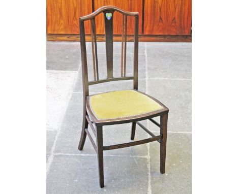 An Edwardian beech chair with Arts and Crafts enamel heart to back. H93cm.