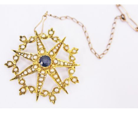 A Victorian 15ct gold half pearl and sapphire star brooch, length 4cm, gross wt. 8.1g.